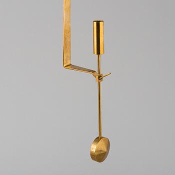 PIERRE FORSSELL, "Pendeln", a pair, brass, Skultuna. Second half of the 20th century.