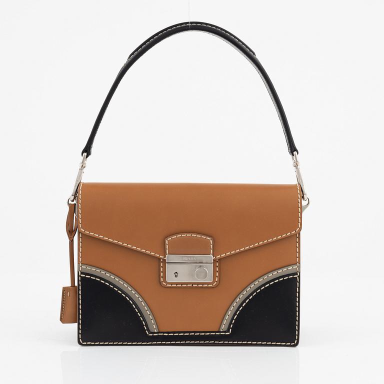 Prada, a leather bag.