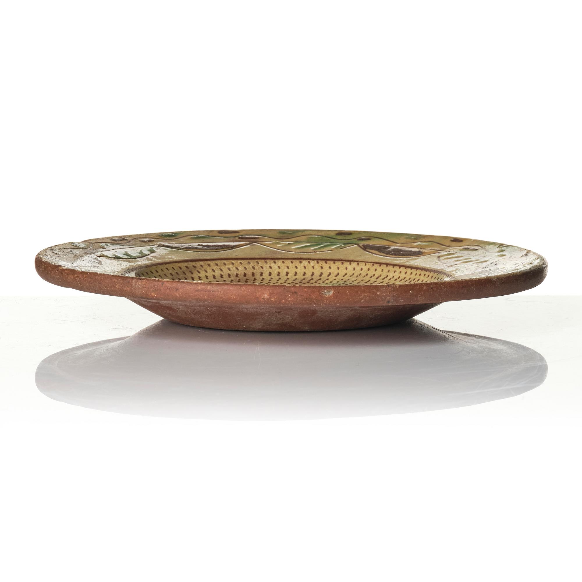 An earthenware dish, dated 1792.