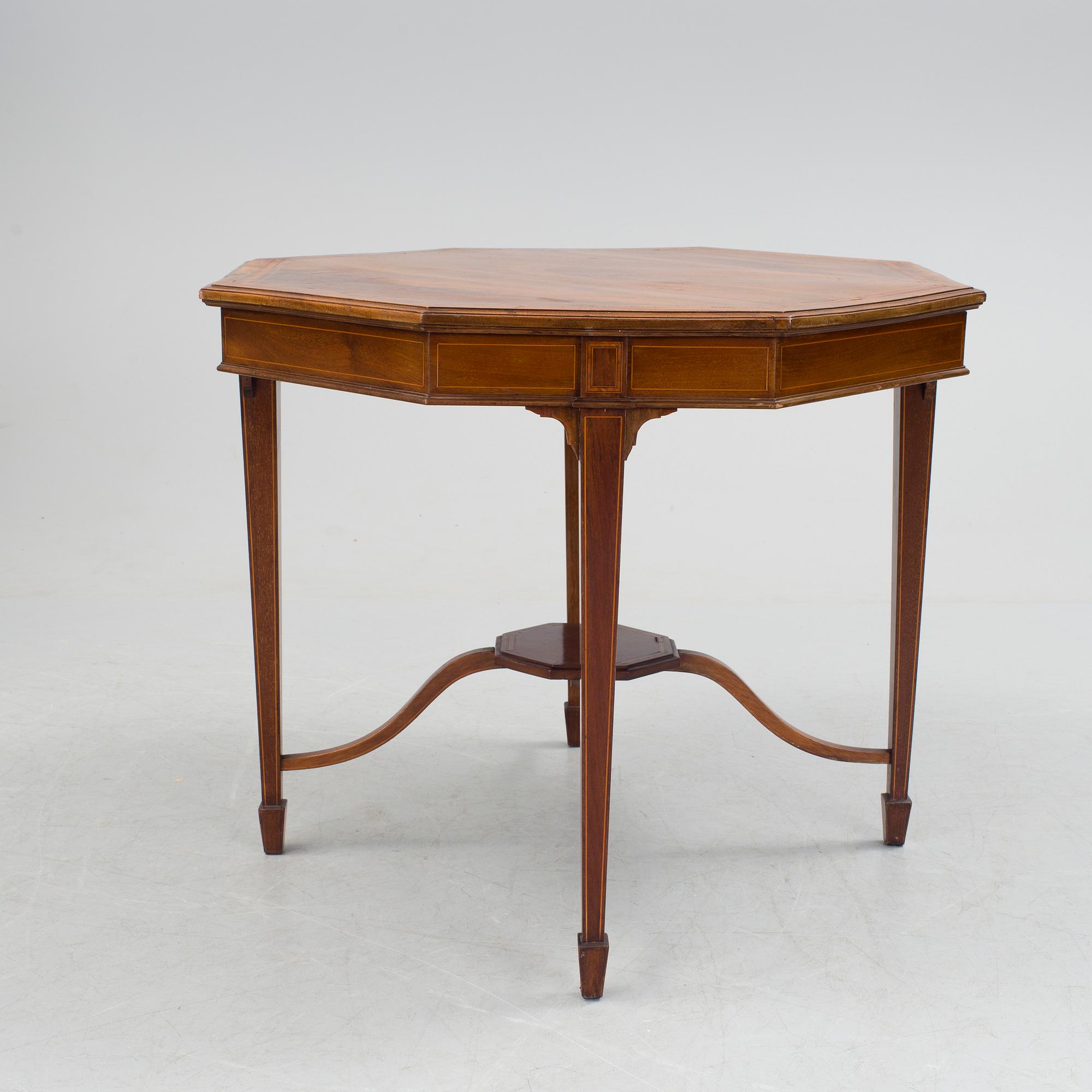 A 1920/30s Swedish Grace sofa, a pair of chairs, a pair of armchairs and a table veneered with mahogany.