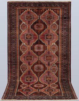 A Beluch rug, approx. 236 x 122 cm.