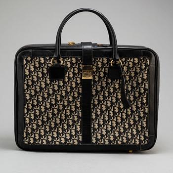 CHRISTIAN DIOR, a suitcase.