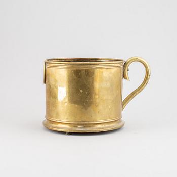 A 19th century brass champagne cooler.