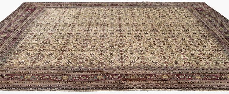 An antique Agra carpet, north India c. 430 x 392 cm.