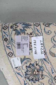 A rug, Nain, part silk, ca 146 x 146 cm.