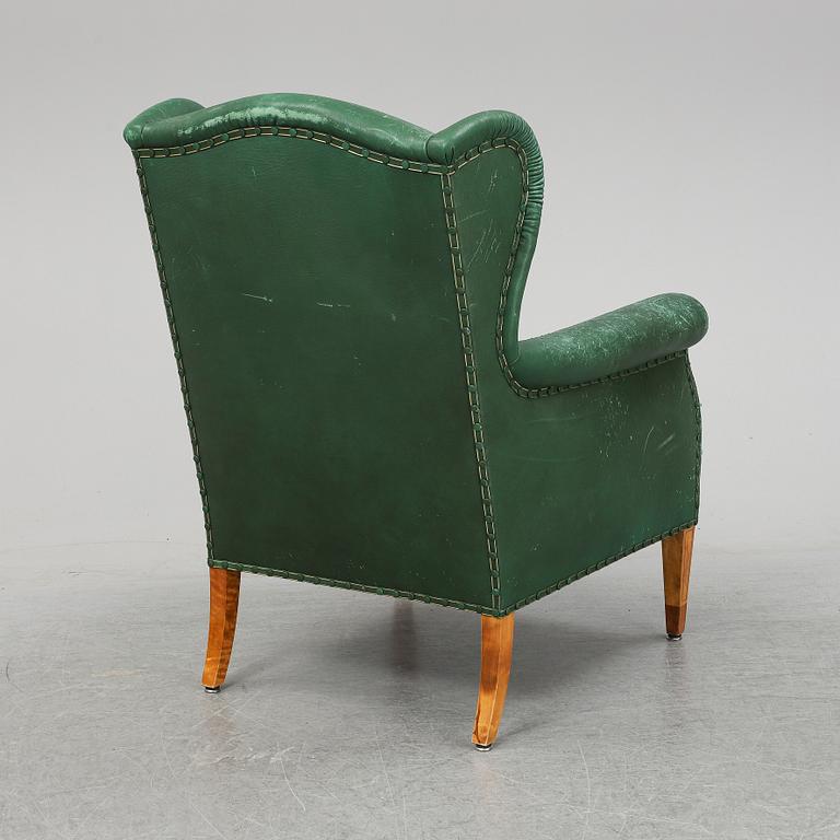 A leather wing-chair.