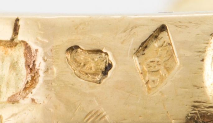 An 18K gold bow ring with French hallmarks.