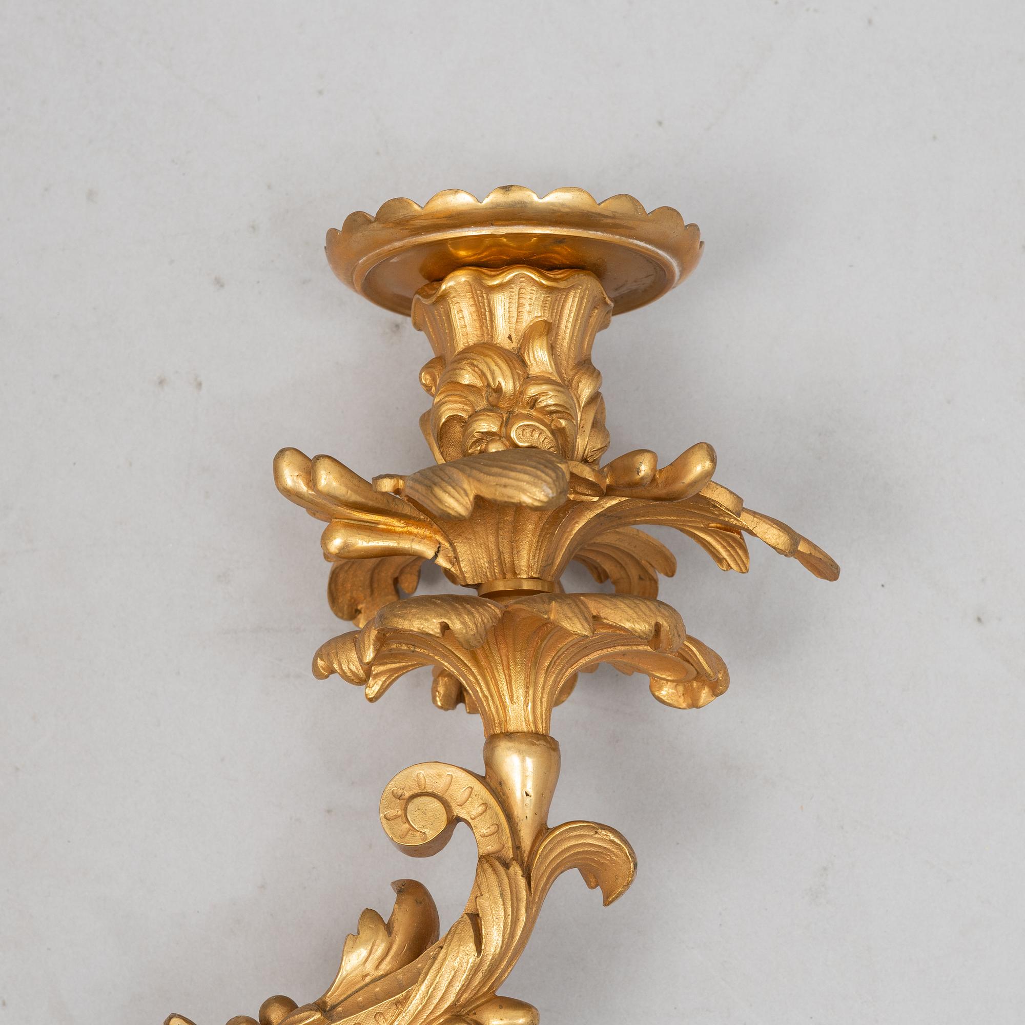 A pair of Louis XV sconces, early 20th century.