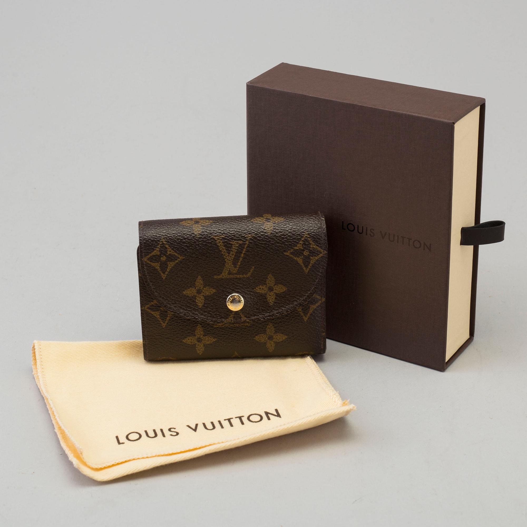 a LOUIS VUITTON 'Helene' wallet.