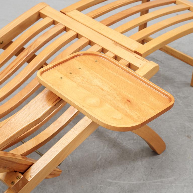 A pair of elm wood lounge chairs, Brogrens, second half of the 20th Century.