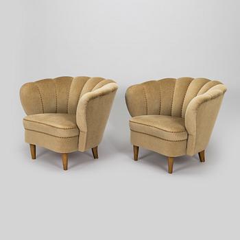 A pair of mid-20th century armchairs.