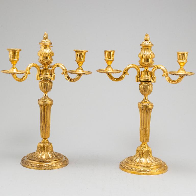 A pair of Louis XVI three-light candelabra.