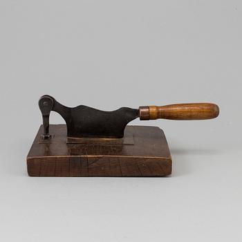 A 19TH CENTURY TOBACCO CUTTER, wood and iron.