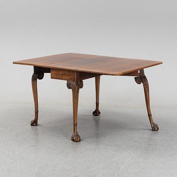 An English mahogany table, 19th Century.
