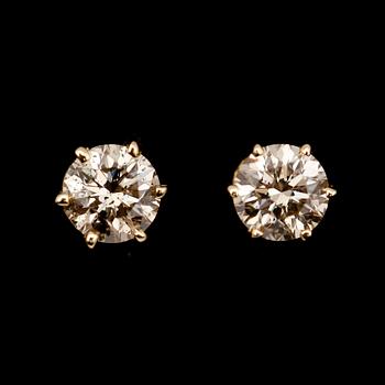 ÖRHÄNGEN, 1 par, 14 k guld, solitära briljantslipade diamanter totalt 0.84 ct.