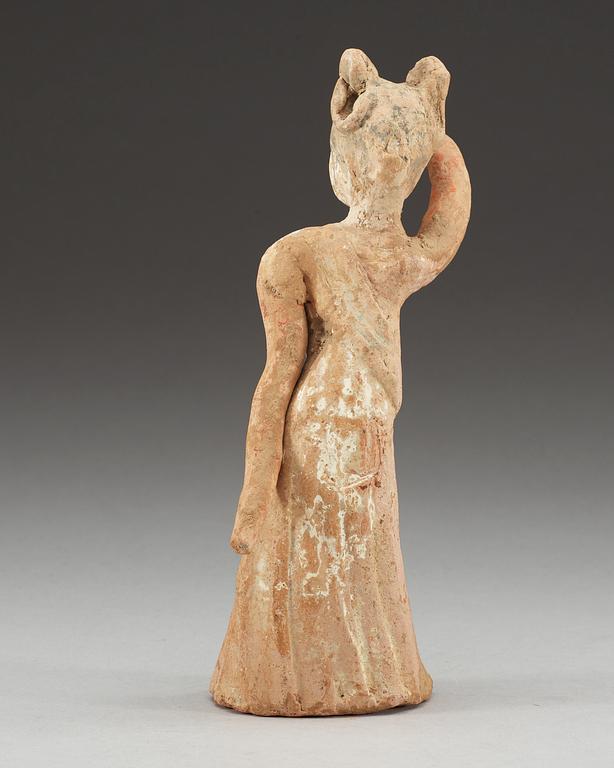 A potted figure of a dancer, Tang dynasty (618-907).