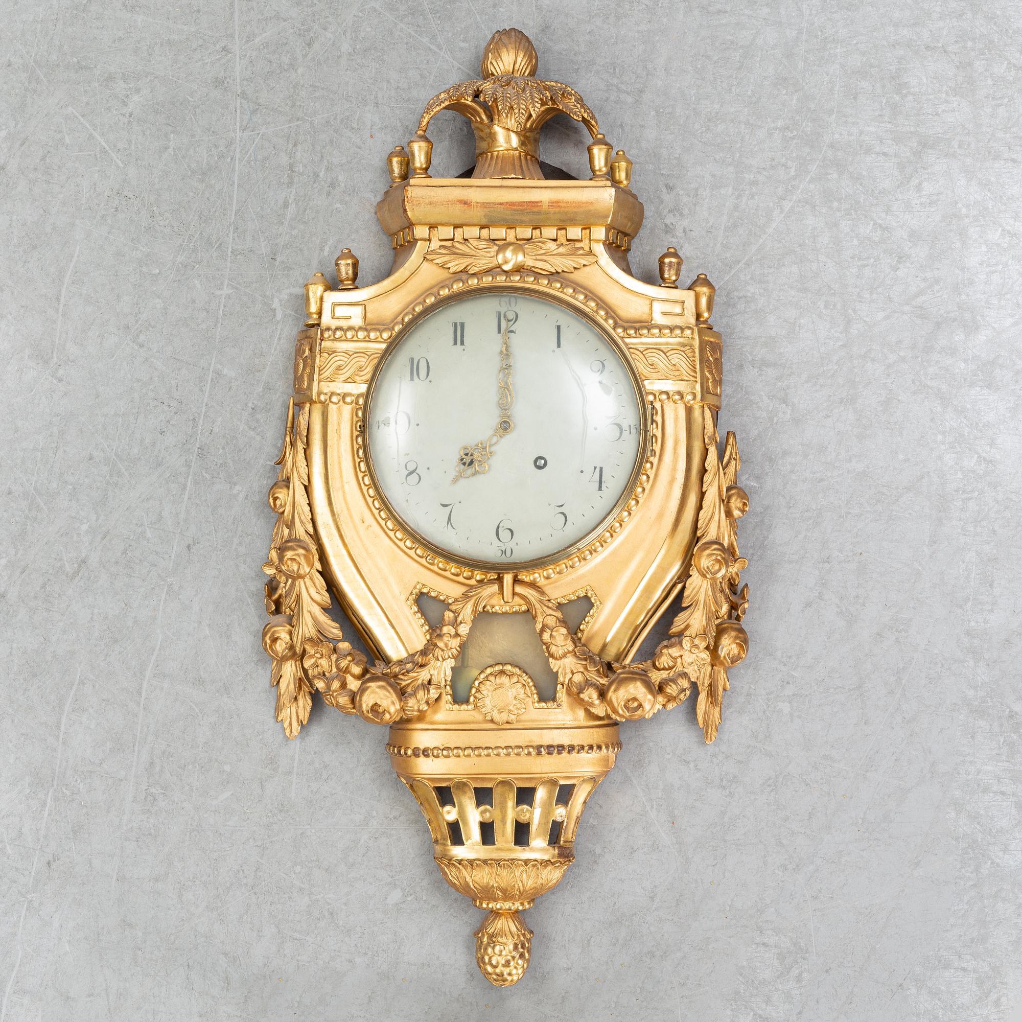 A Gustavian pendulum wall clock.