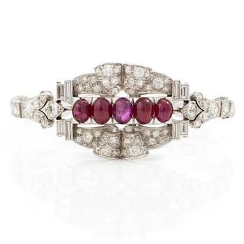 524. A bracelet platinum set with old- and baguette-cut diamonds and cabochon-cut rubies, circa 1930-40s.