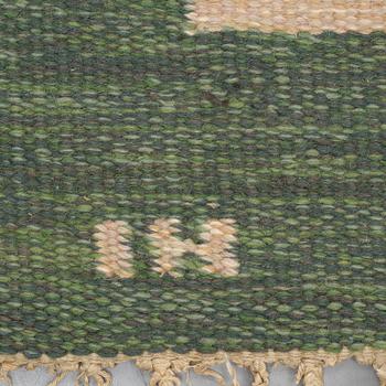 A carpet, flat weave, ca 227,5 x 163,5-168,5 cm, signed IH.