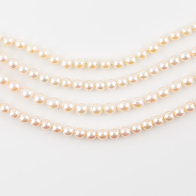 Four rows of cultured pearls, without a clasp.