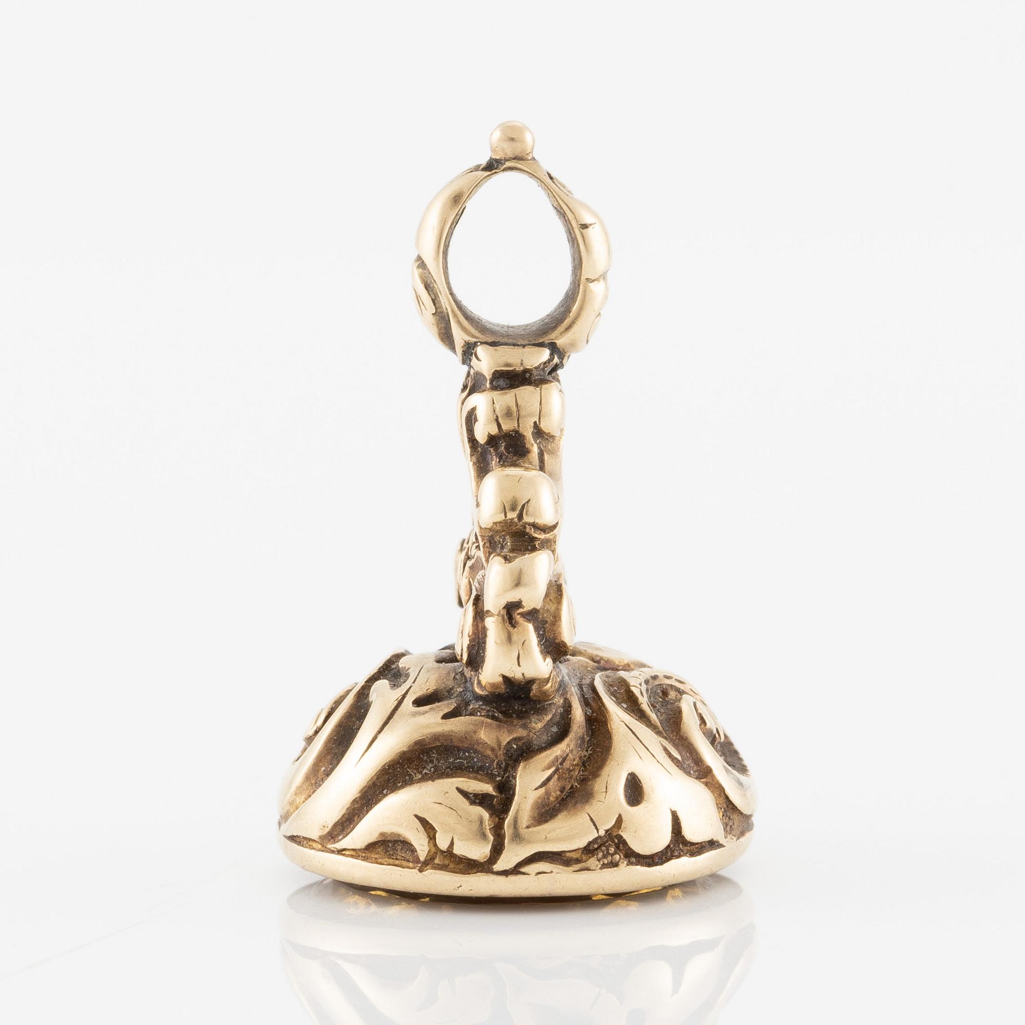 Sigill 14K guld och graverad gulaktig sten, möjligen citrin.