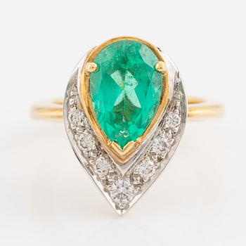 Pear shaped emerald and brilliant cut diamond ring.