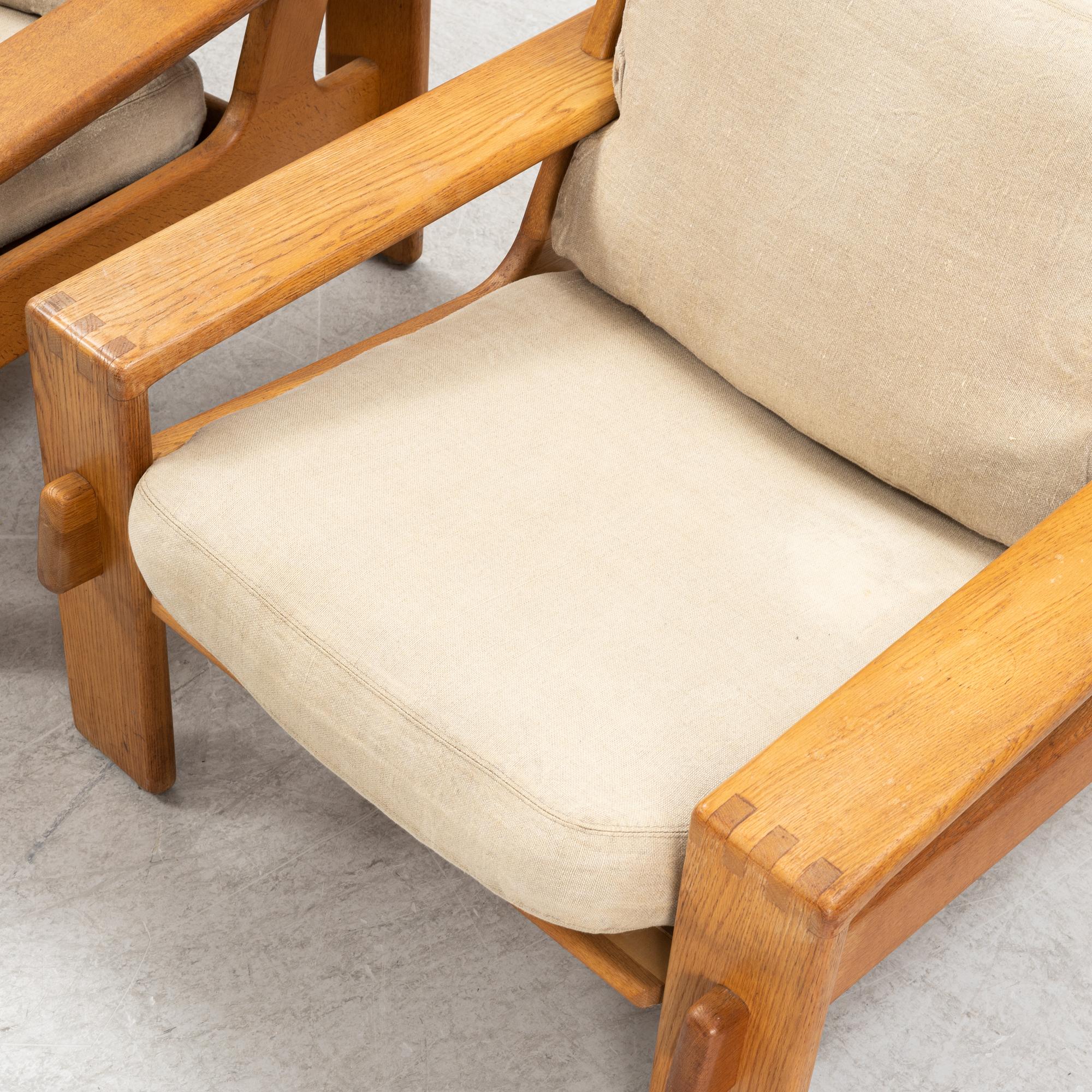 Esko Pajamies, a pair of oak 'Bonanza' lounge chairs from Asko, 1970's.