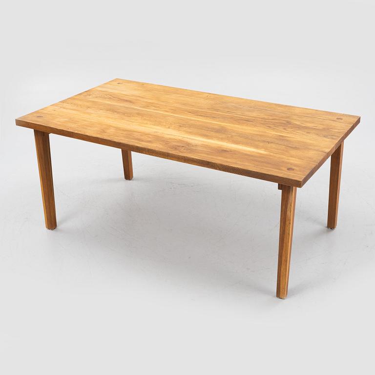 A dining table, later part of the 20th Century.
