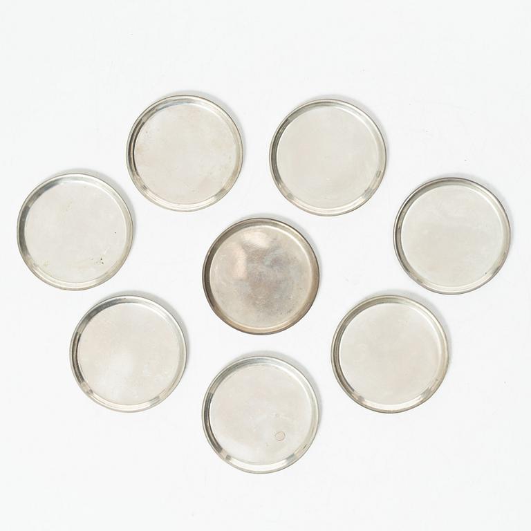 Eight coasters, silver 900, 20th century.