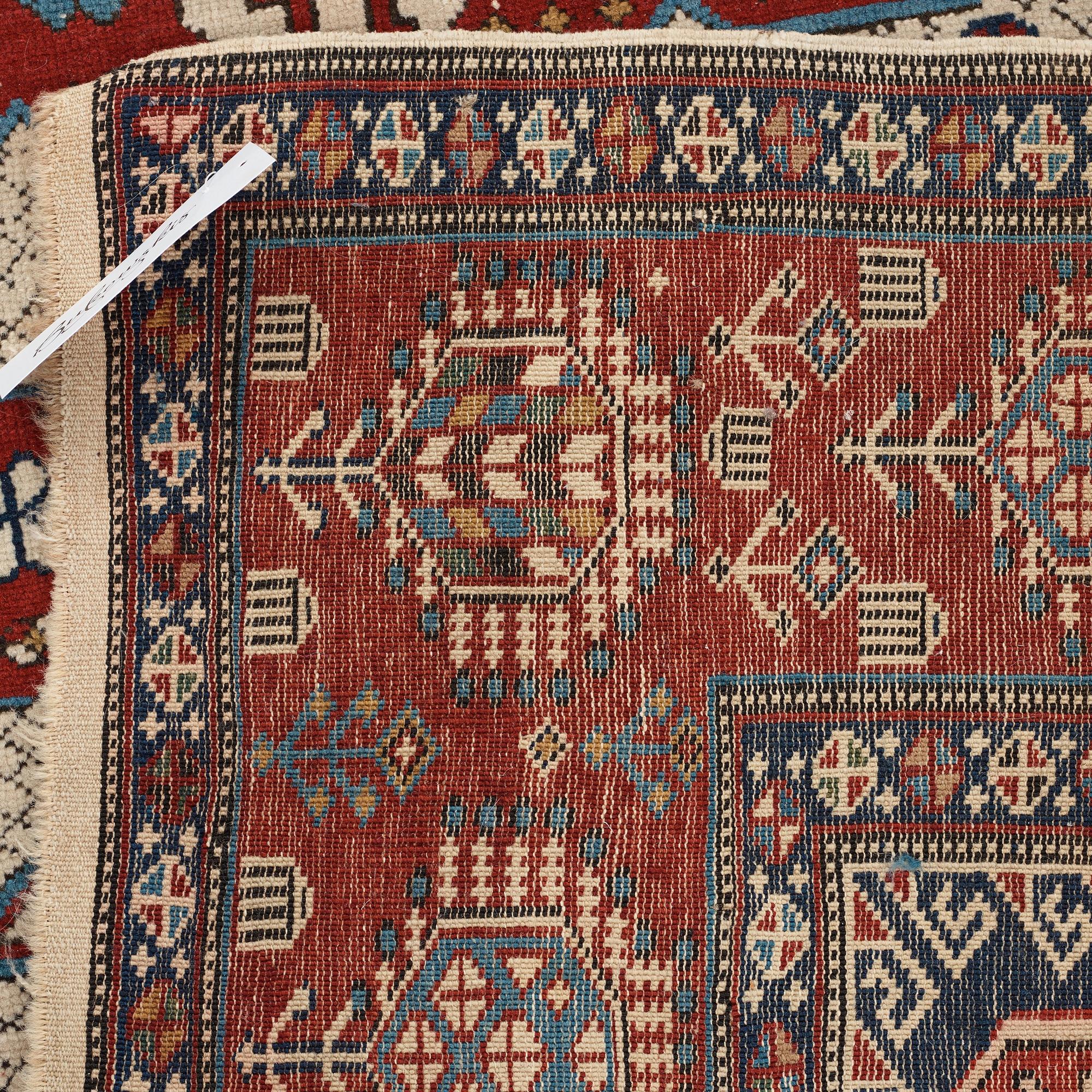 A CARPET, an antique/semi-antique Shirvan, ca 234 x 130 cm (as well as the ends with 1 cm flat weave).