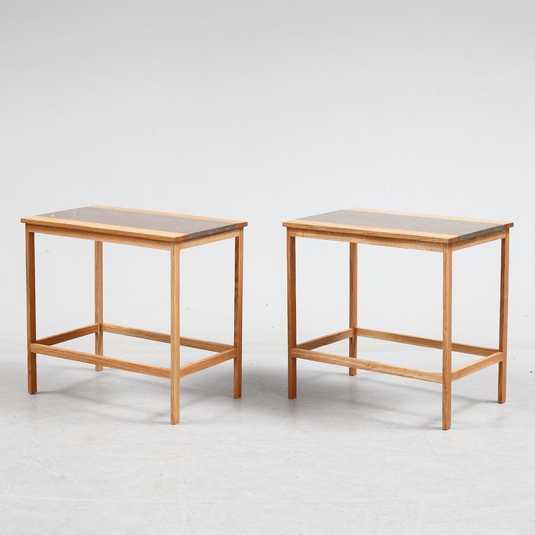 A pair of of oak and limestone tables, 21th century.