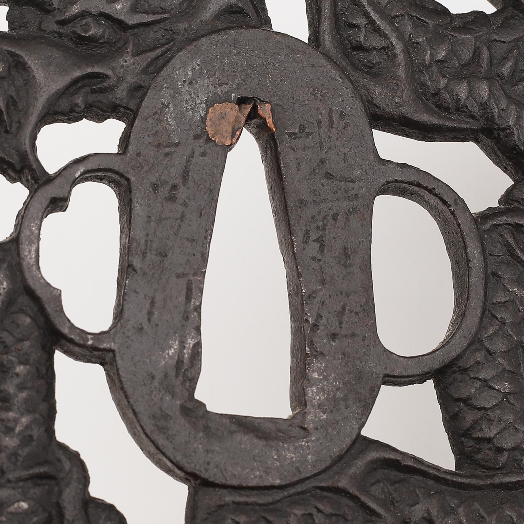 Five iron tsubas with dragon motives, probably 19th Century.