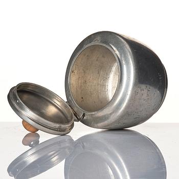 Josef Frank, a four-piece pewter tea set and a plate, model "A2330", Firma Svenskt Tenn, Stockholm 1946 (plate 1929).