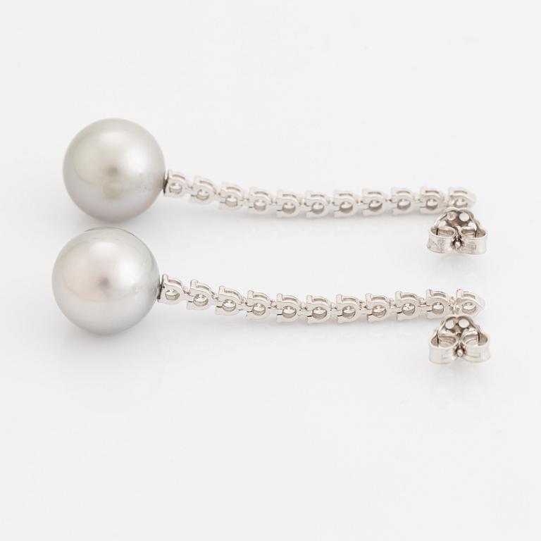 Tahit pearl and brilliant-cut diamond earrings.