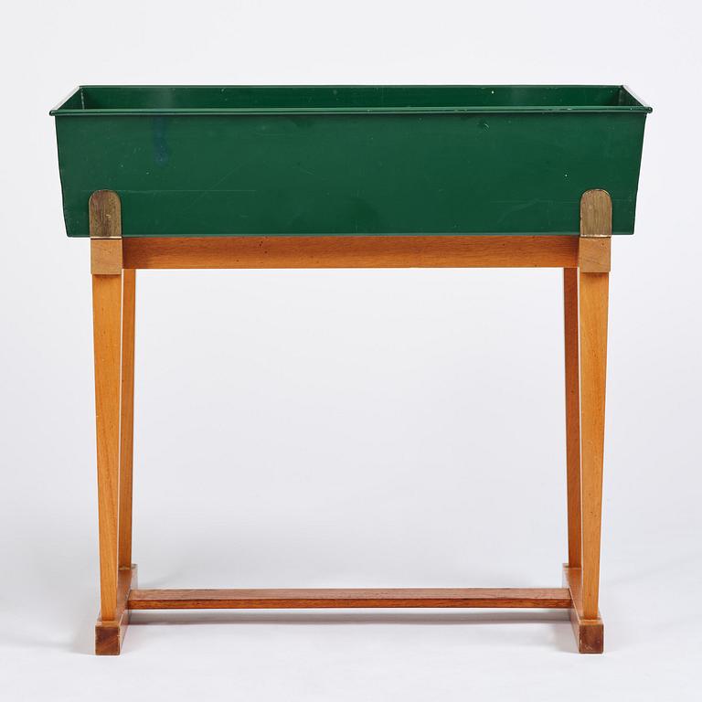 Josef Frank, a rare flower table with green lacquered box model B 2084, Firma Svenskt Tenn, 1950-60s.