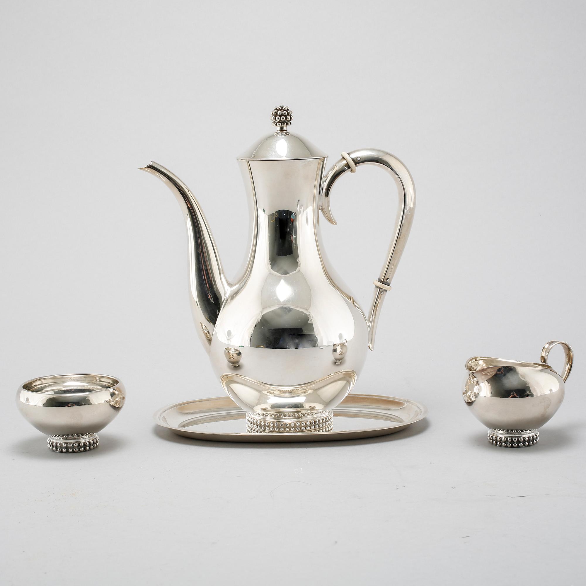 A silver coffee set of four pieces from the middle of the 20th century.
