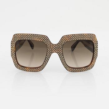 Gucci, a pair of black plastic and rhinestone sunglasses.