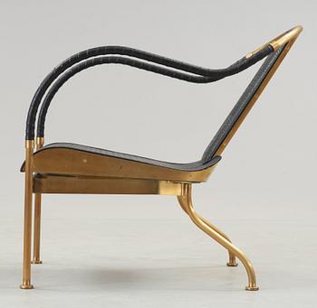 A Mats Theselius 'El Rey' brass and leather easy chair, by Källemo, Sweden.