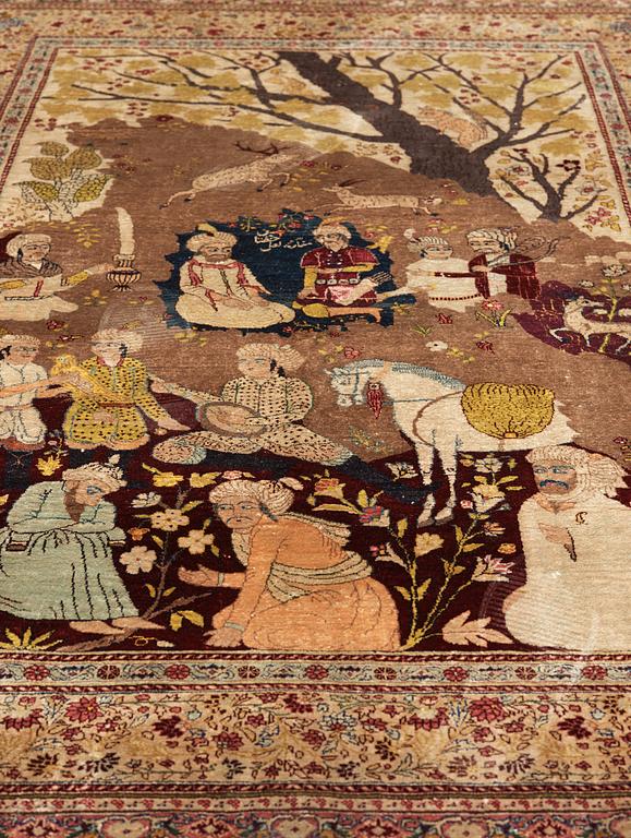 A CARPET, a semi-antique silk Tabriz figural, signed Haddad, 180,5 x 123,5 cm.