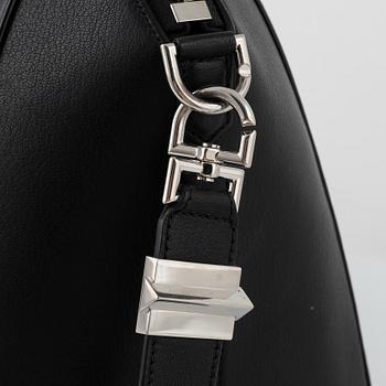 Givenchy, a black leather 'Antigona' bag.