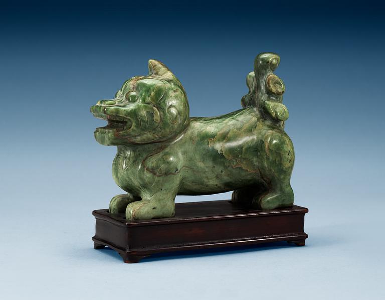 A nephrite figure of a Buddhist Lion, late Qing dynasty.