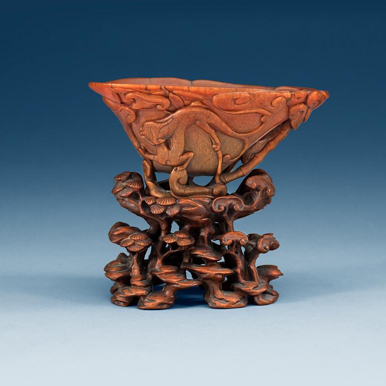 A finely carved rhinoceros libation cup, Qing dynasty, Kangxi (1662-1722).