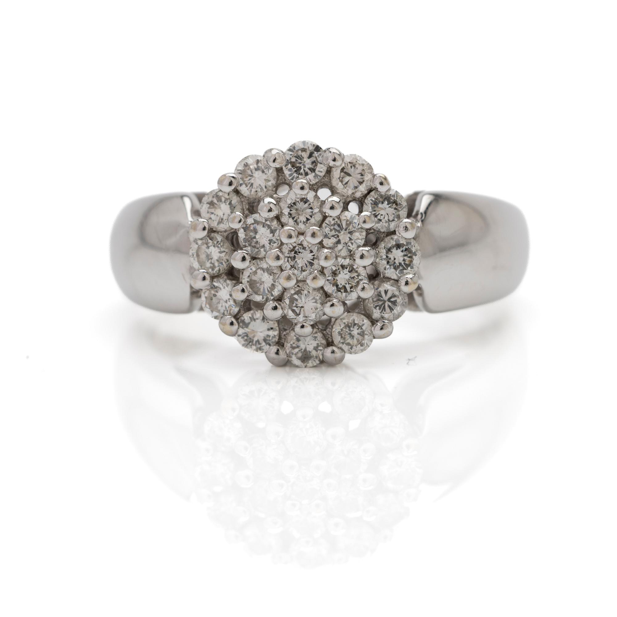 18K white gold ring with diamonds.
