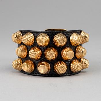 BALENCIAGA, a studded leather bracelet.