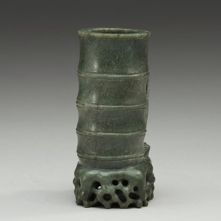 A green stone brush pot, China, 20th Century.