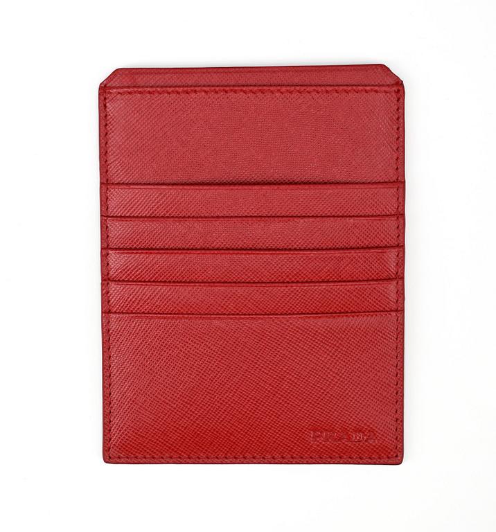 PRADA, a red leather credit card holder.