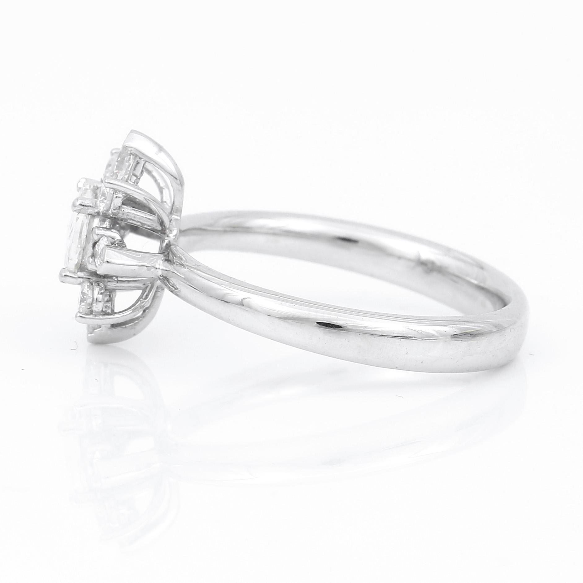 RING, 18K vitguld med rosenslipad diamant 0,33 ct och markis samt briljantslipade diamanter tot ca  0,34 ct. Vikt 4,53 g.