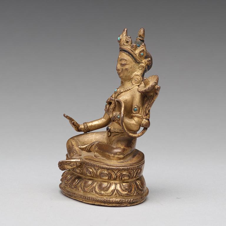 A Tibetan gilt copper alloy figure of Tara, 18th Century or older.