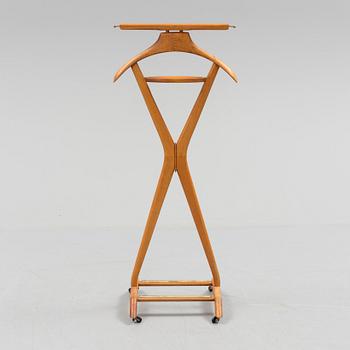 A late 20th century Fratelli Reguitti stand for men's clothes.