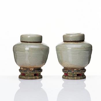 A pair of Japanese celadon jars with cover, Edo period (1603-1868).